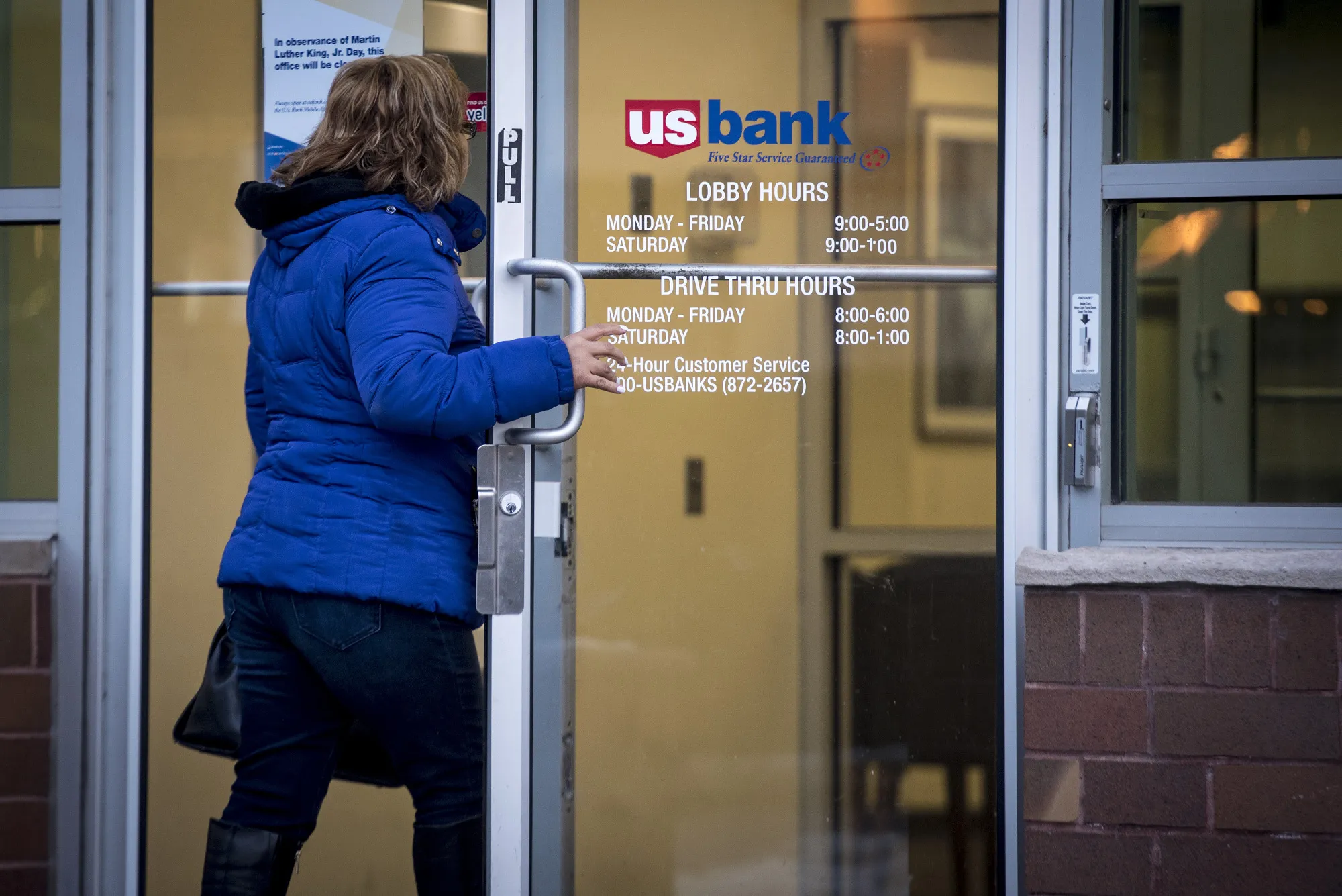 A customer enters a US Bancorp branch in downtown Chicago.