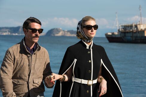 In Persol shades and a Massimo Rebecchi leather jacket, Alexander leads an on-point Victoria to their Riva boat.