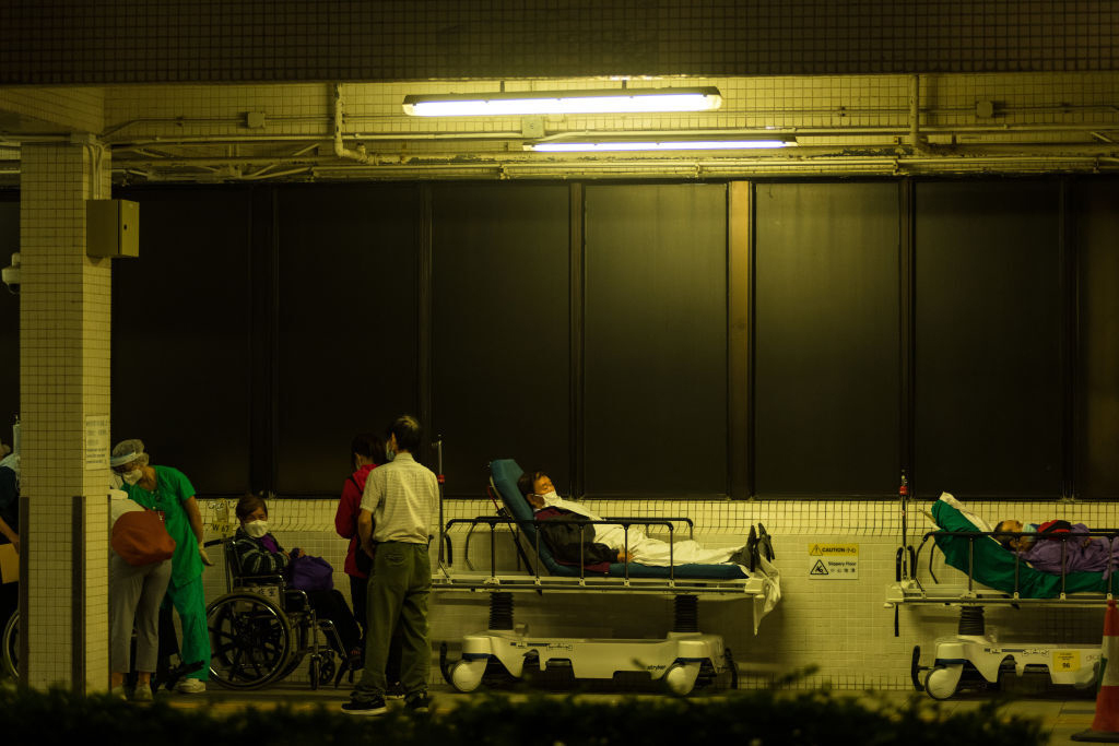 Patients wait outdoors for available beds at Hong Kong’s Princess Margaret Hospital on March 16. 