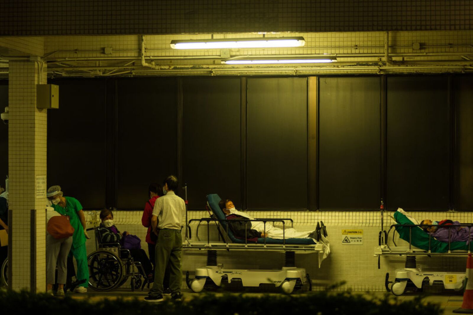 Patients&nbsp;wait outdoors for available beds at Hong Kong’s Princess Margaret Hospital&nbsp;on March 16.&nbsp;