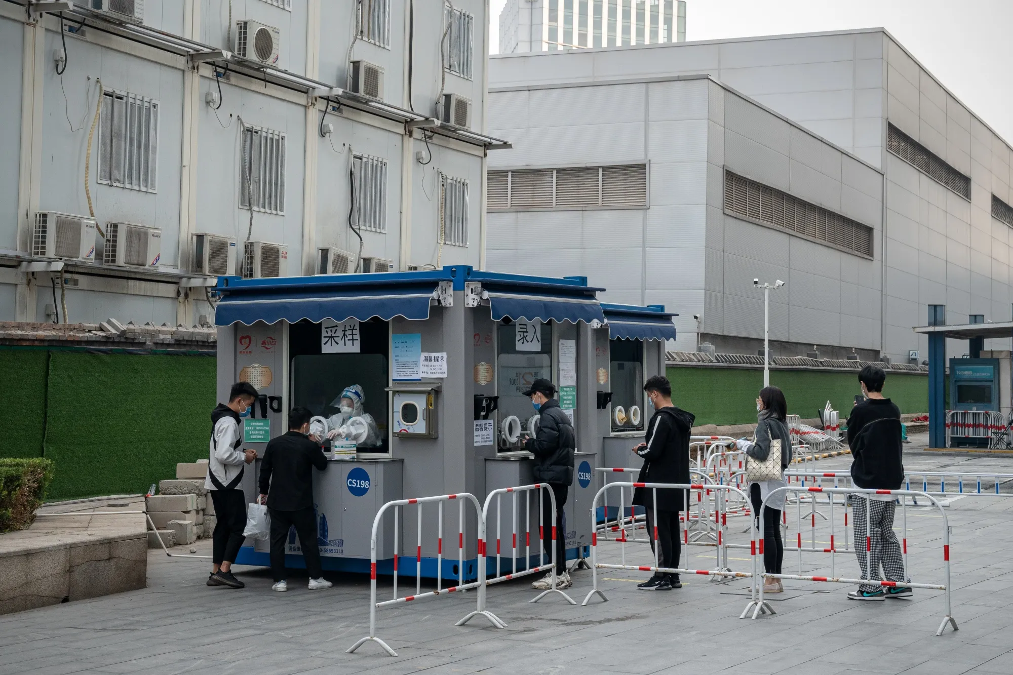 Residents at a Covid-19 testing station in Beijing on&nbsp;Oct. 12.