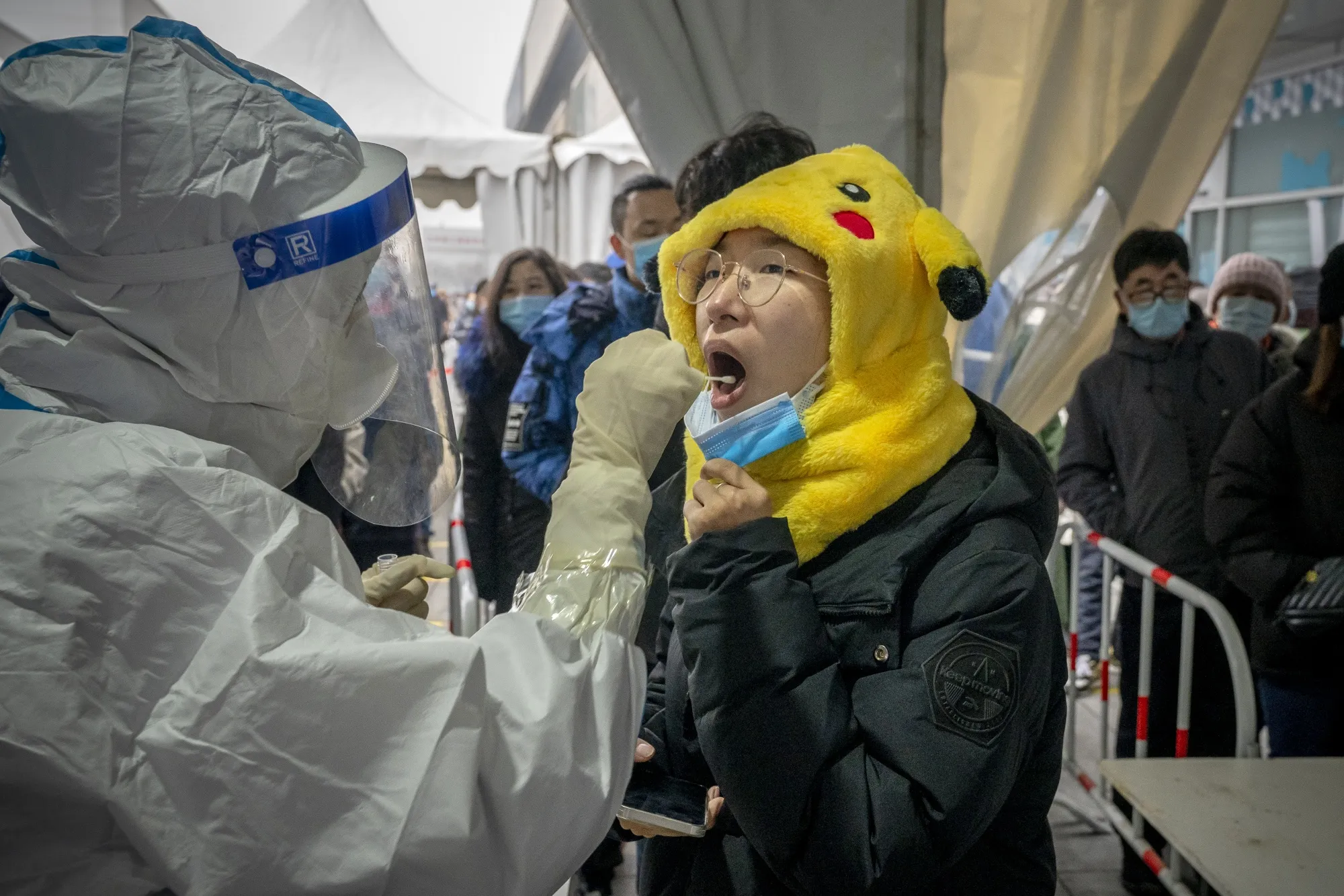 A member of the public receives a Covid-19 test in Beijing, China.