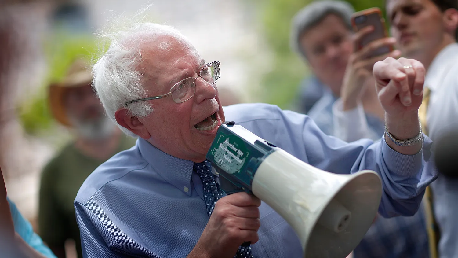 Democratic presidential candidate and U.S. Sen. Bernie Sanders (I-VT) speaks to an overflow crowd through a megaphone after a campaign event at the New England College May 27, 2015 in Concord, New Hampshire.
