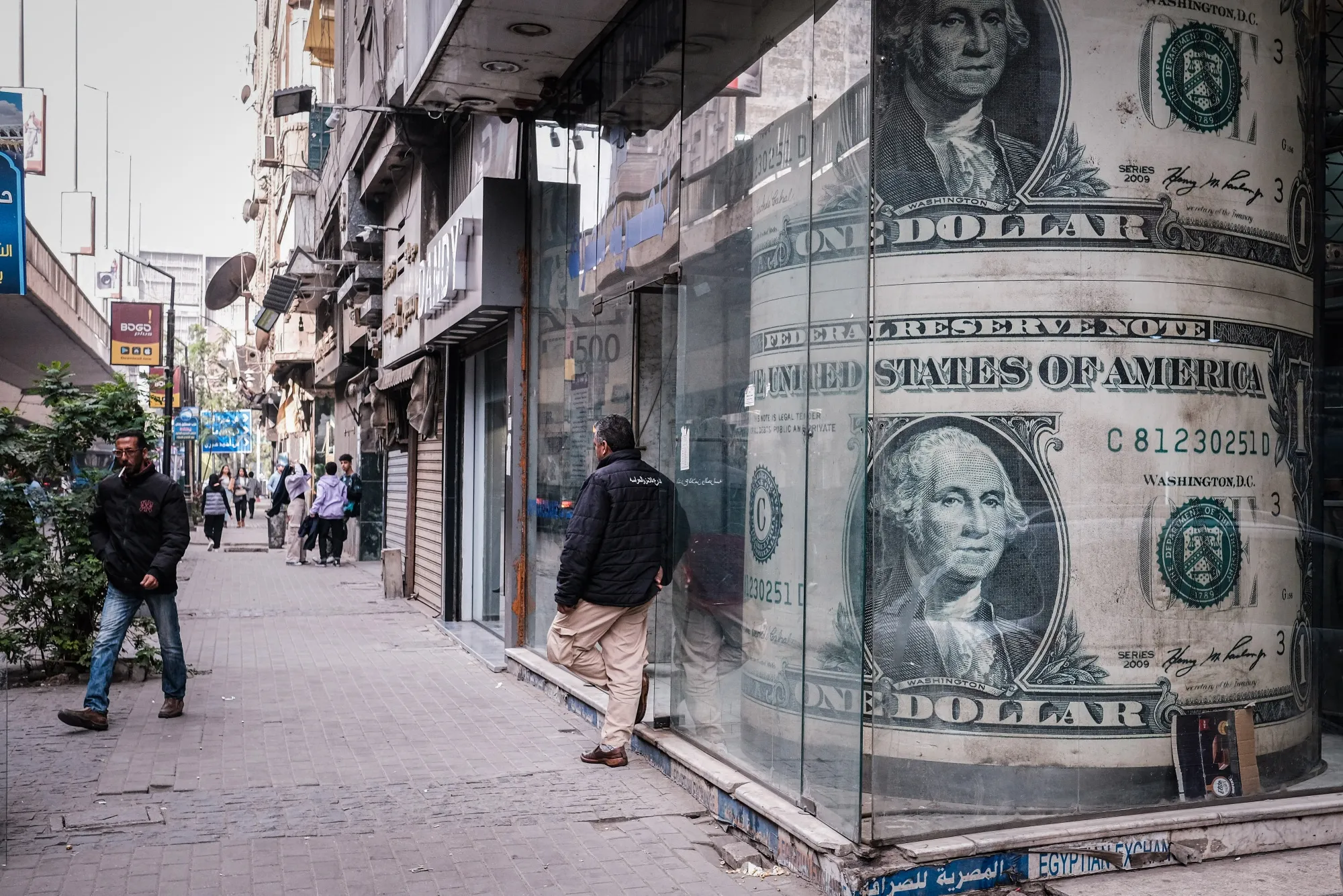 Images of US one dollar bills in the window of a currency exchange bureau in the Zamalek district of Cairo, Egypt,.