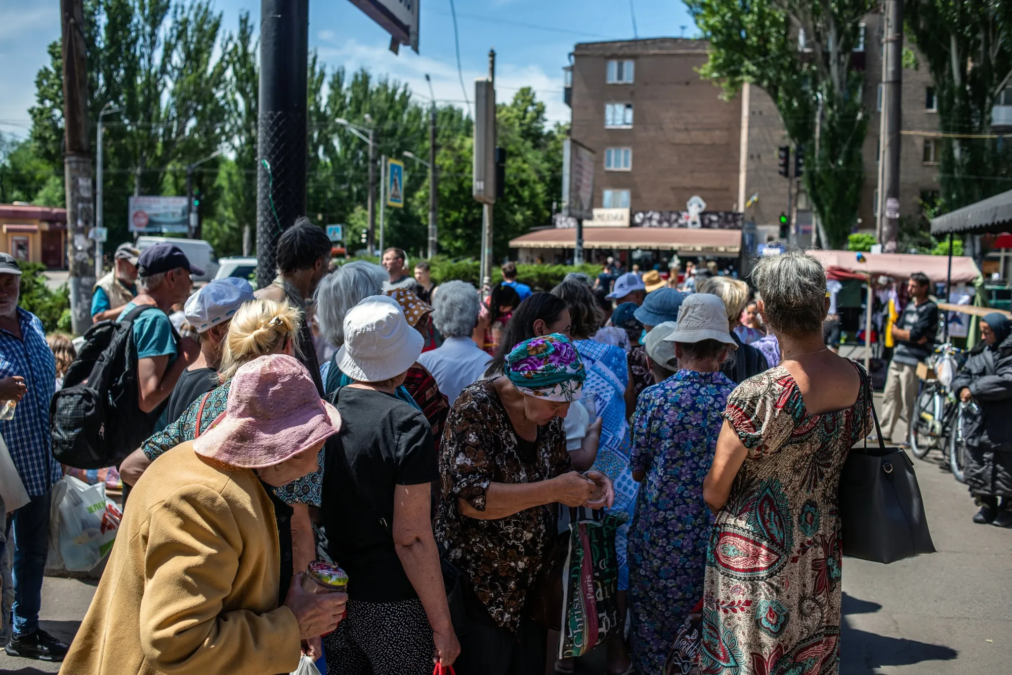 Waiting in line for free food distributed by a charity in central Ukraine.