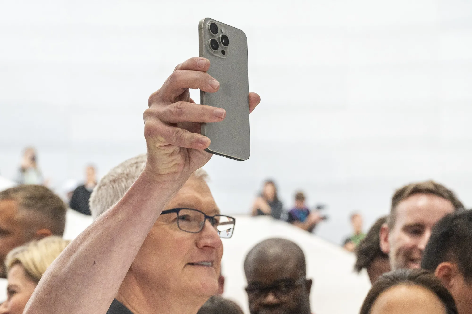 Tim Cook with a new Apple iPhone 15 Pro Max during an event at Apple Park campus on Sept. 12.