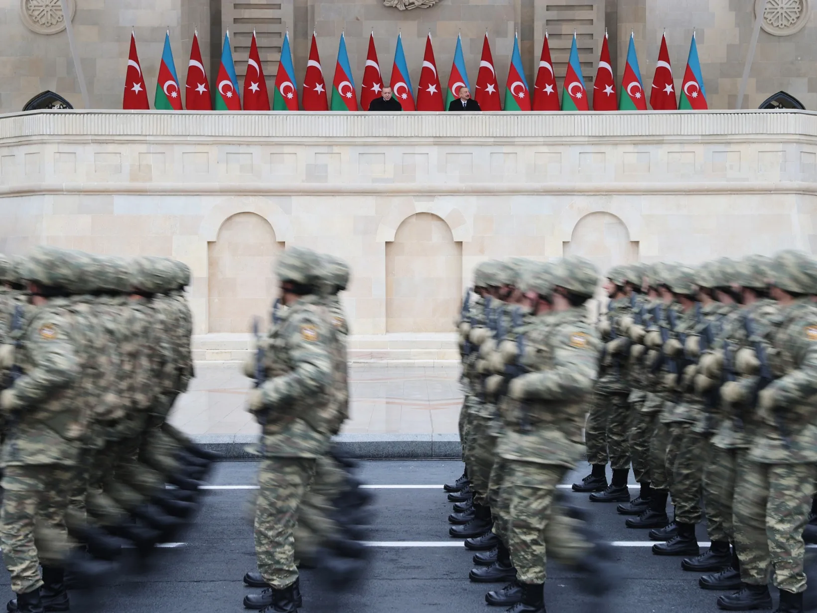 Recep Tayyip Erdogan and Ilham Aliyev watch over a victory parade in Baku, Azerbaijan, on Dec. 10.