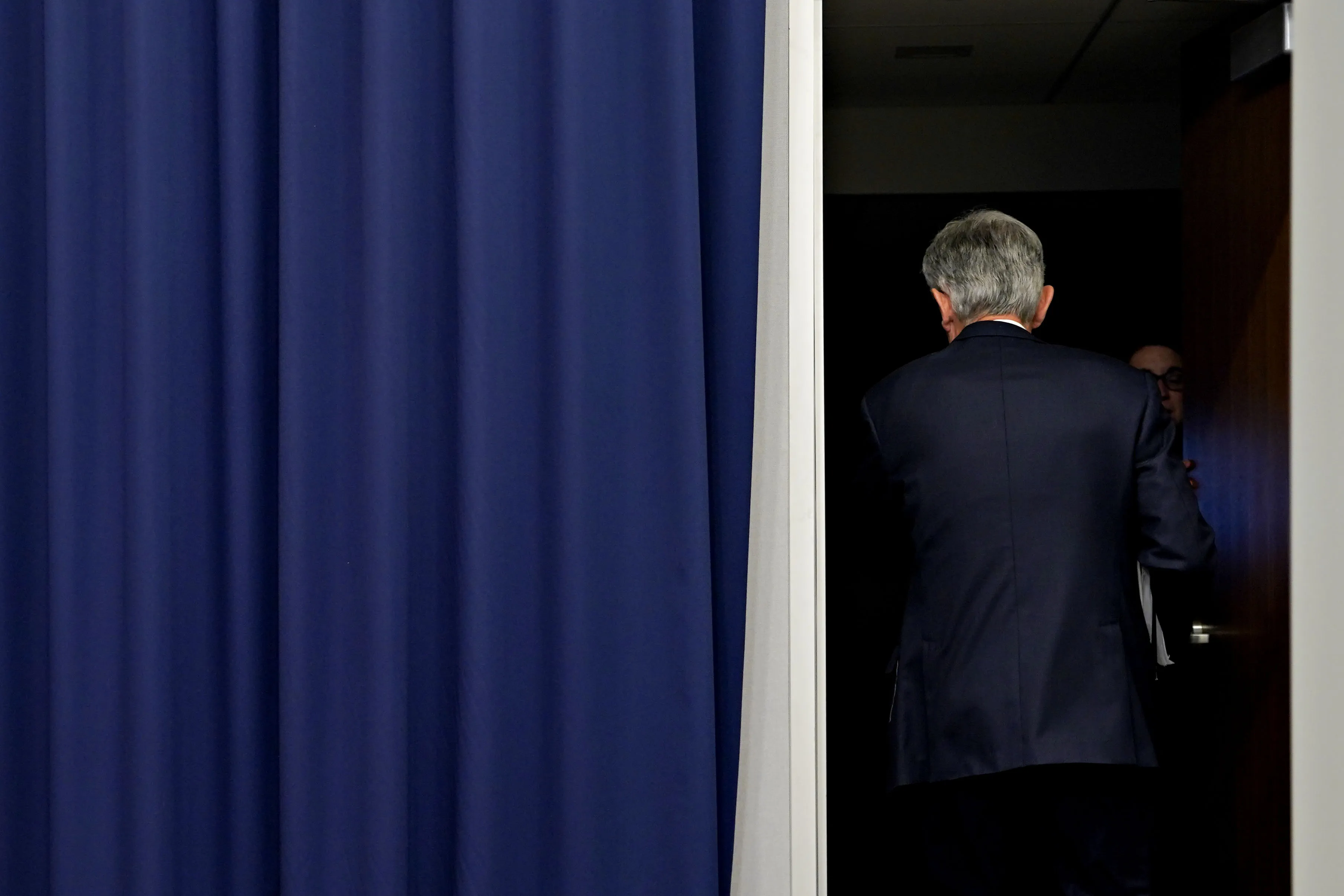 Jerome Powell, chairman of the US Federal Reserve, exits following a news conference following a Federal Open Market Committee (FOMC) meeting in Washington, DC, US, on Wednesday, March 22, 2023. The Federal Reserve raised interest rates by a quarter percentage point and signaled it's not finished hiking, despite the risk of exacerbating a bank crisis that's roiled global markets.