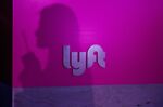 The shadow of an attendee is seen on Lyft Inc. signage displayed during the company's initial public offering (IPO) .