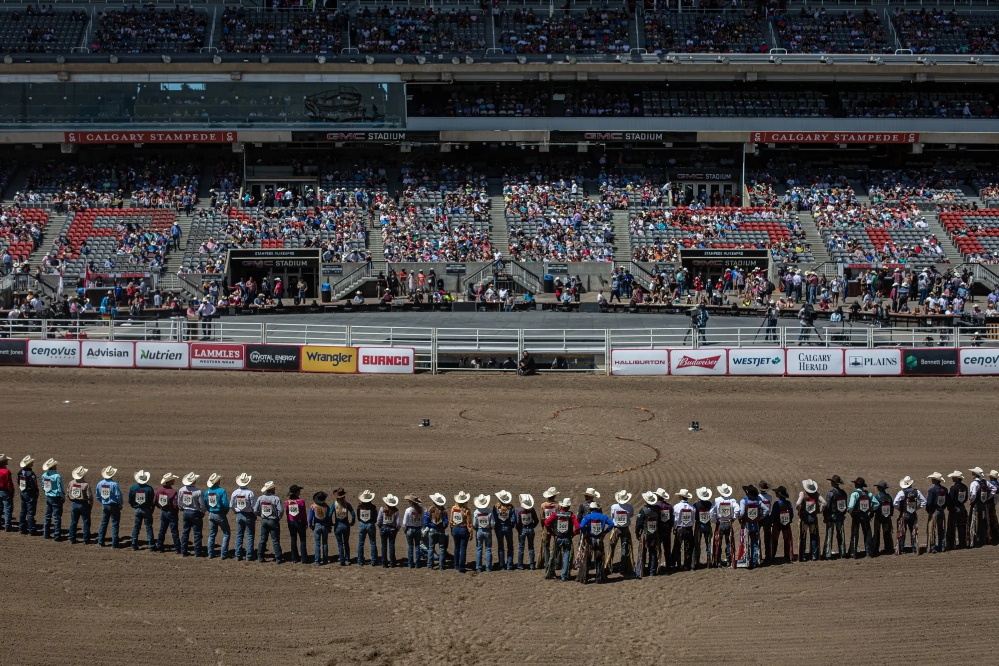 Competitors line up during Grand Entry of the rodeo at the Calgary Stampede in Calgary in 2022.