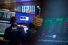 Traders work on the floor of the New York Stock Exchange (NYSE) in New York, U.S., on Monday, April 16, 2018. U.S. stocks rallied and Treasuries slid as geopolitical tensions eased and investors turned their attention to corporate results.