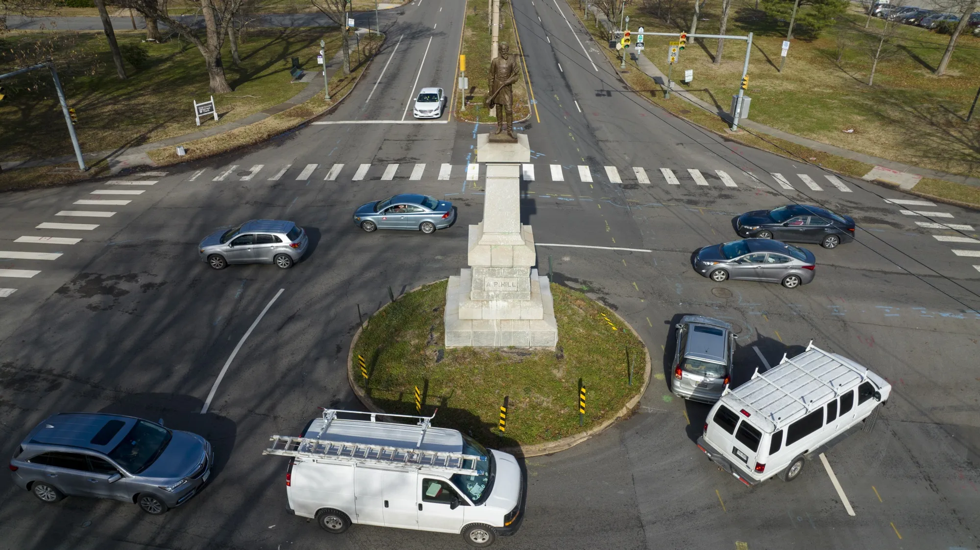Traffic drives in the circle at the monument of confederate General A.P. Hill, which contains his remains, is in the middle of a traffic circle on Arthur Ashe Blvd. Jan. 6, 2022, in Richmond, Va. Work to relocate Richmond’s final city-owned Confederate monument should start this week after a judge refused a request to delay the removal of the statue of Gen. A.P. Hill from its prominent spot in Virginia's capital, an official said. (AP Photo/Steve Helber, File)