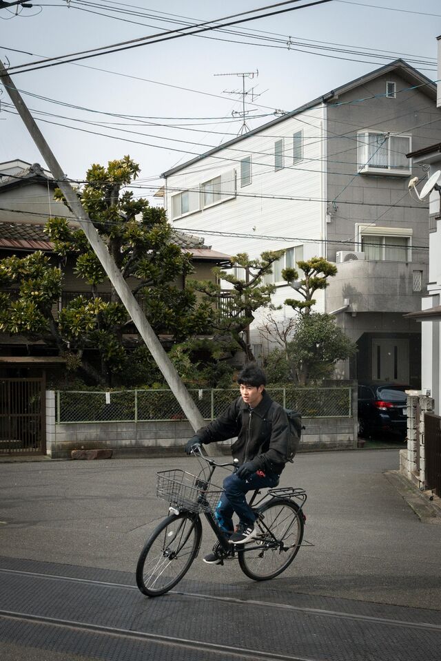 A person bikes through the Northern Higashiyama neighborhood.