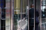 An office worker enters the JPMorgan Chase & Co. headquarters in New York.