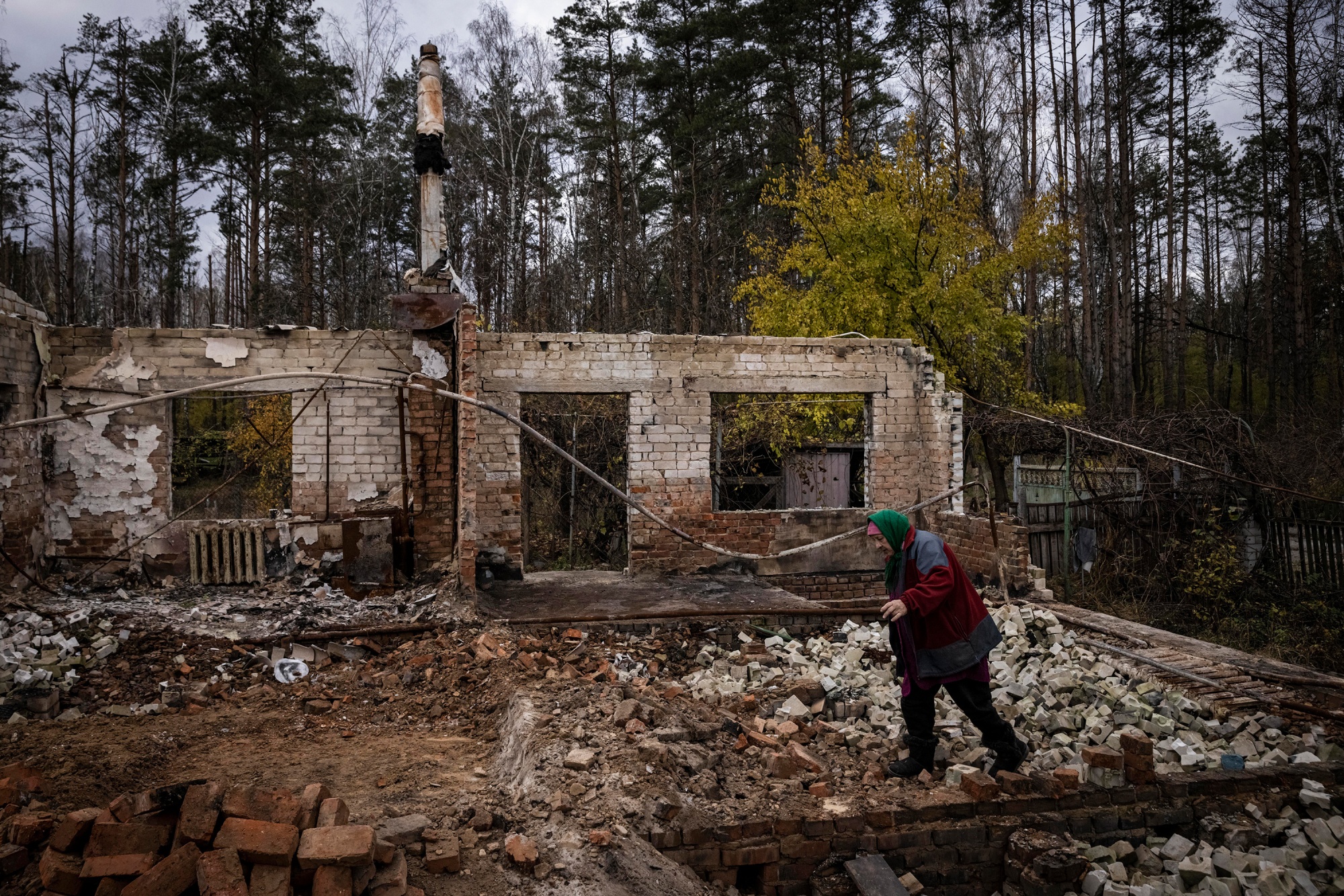A woman at her destroyed home in Yahidne village, Chernihiv, Ukraine, on Oct. 30.