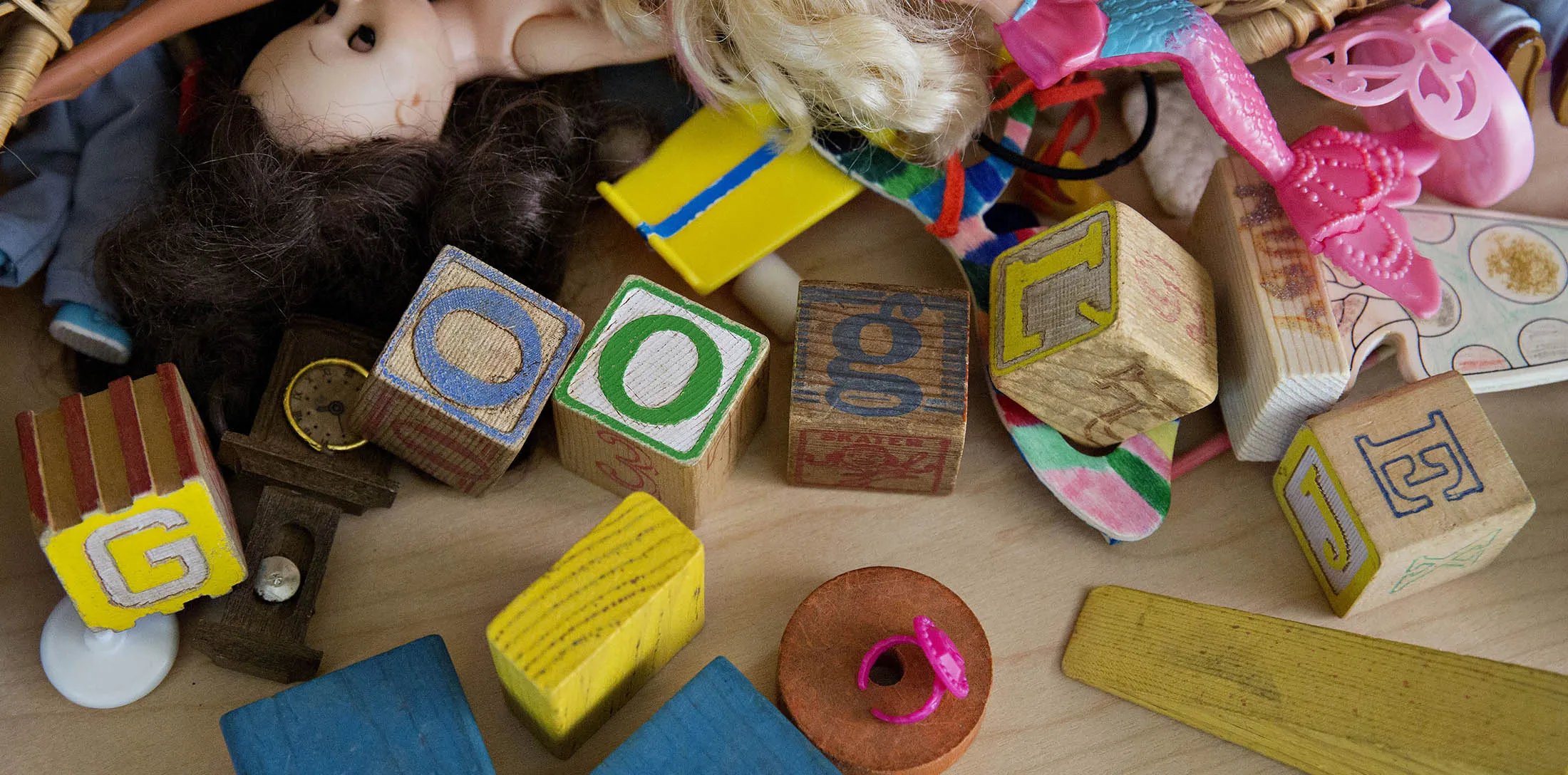 Children's blocks spell out the word 'Google' in this arranged photograph taken in Tiskilwa, Illinois, U.S., on Tuesday, Aug. 11, 2015. Google Inc. rose as much as 6.5 percent after reorganizing into a holding company called Alphabet Inc., breaking out its main Web operations from ambitious new endeavors such as research lab Google X and Calico, which seeks to extend human lives. The structure, announced Monday, will give greater clarity into how Google invests in various ventures, including driverless cars, high-speed Internet service and health-related technologies.

