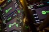 Monitors display Spotify Technology SA signage during the company's first day of trading on the floor of the New York Stock Exchange (NYSE) in New York, U.S., on Tuesday, April 3, 2018. Spotify shares climbed in the minutes after it began trading through a direct listing. The company skipped the traditional initial public offering process in favor of a route rarely taken by large, established companies.
