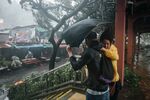 People brave the winds of Typhoon Mangkhut in Hong Kong, China, Sept. 16, 2018.&nbsp;