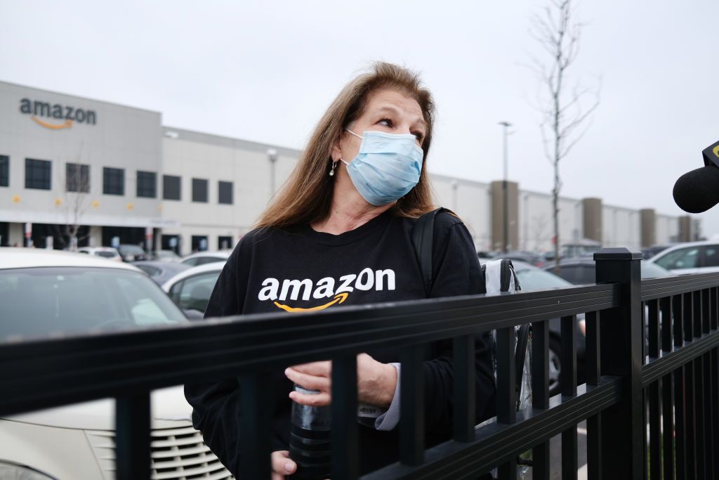 Amazon Workers Sue Over Virus Brought Home From Warehouse - Bloomberg