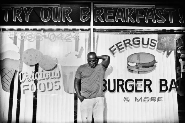 Charles Davis in front of the Ferguson Burger Bar &amp; More