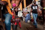 Vendors and customers at the Congolese market in Luanda. 