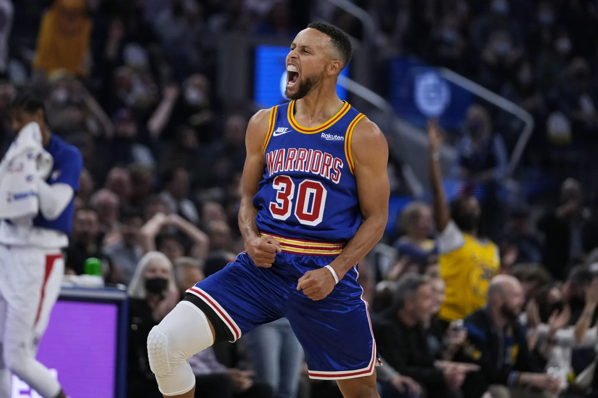 Golden State Warriors guard Stephen Curry (30) reacts after making a 3-point shot against the Los Angeles Clippers during the first half of an NBA basketball game in San Francisco, Thursday, Oct. 21, 2021. (AP Photo/Tony Avelar)