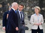 French President Emmanuel Macron, second right, walks arm in arm with US President Joe Biden at the Group of Seven leaders summit in June 2021.