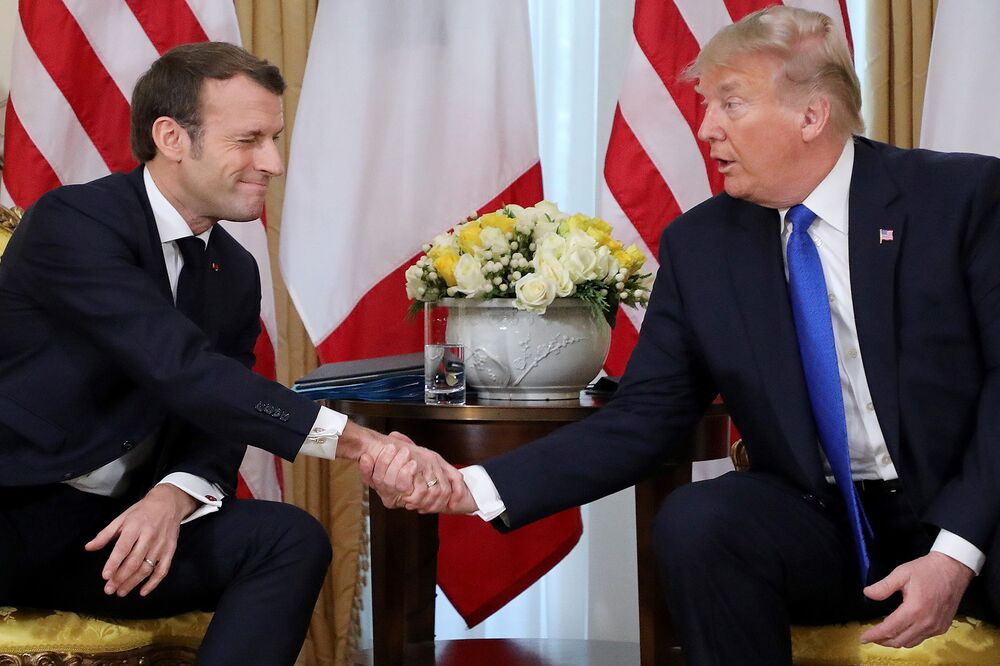 Donald Trump and Emmanuel Macron shake hands during their meeting at Winfield House, London on Dec. 3, 2019.