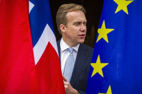 Norwegian foreign minister Boerge Brende is seen between the Norwegian (L) and EU flag on his arrival for a meeting with German foreign minister at the foreign ministry's Villa Borsig at lake Tegel in Berlin October 17, 2014. AFP PHOTO / ODD ANDERSEN (Photo credit should read ODD ANDERSEN/AFP/Getty Images)