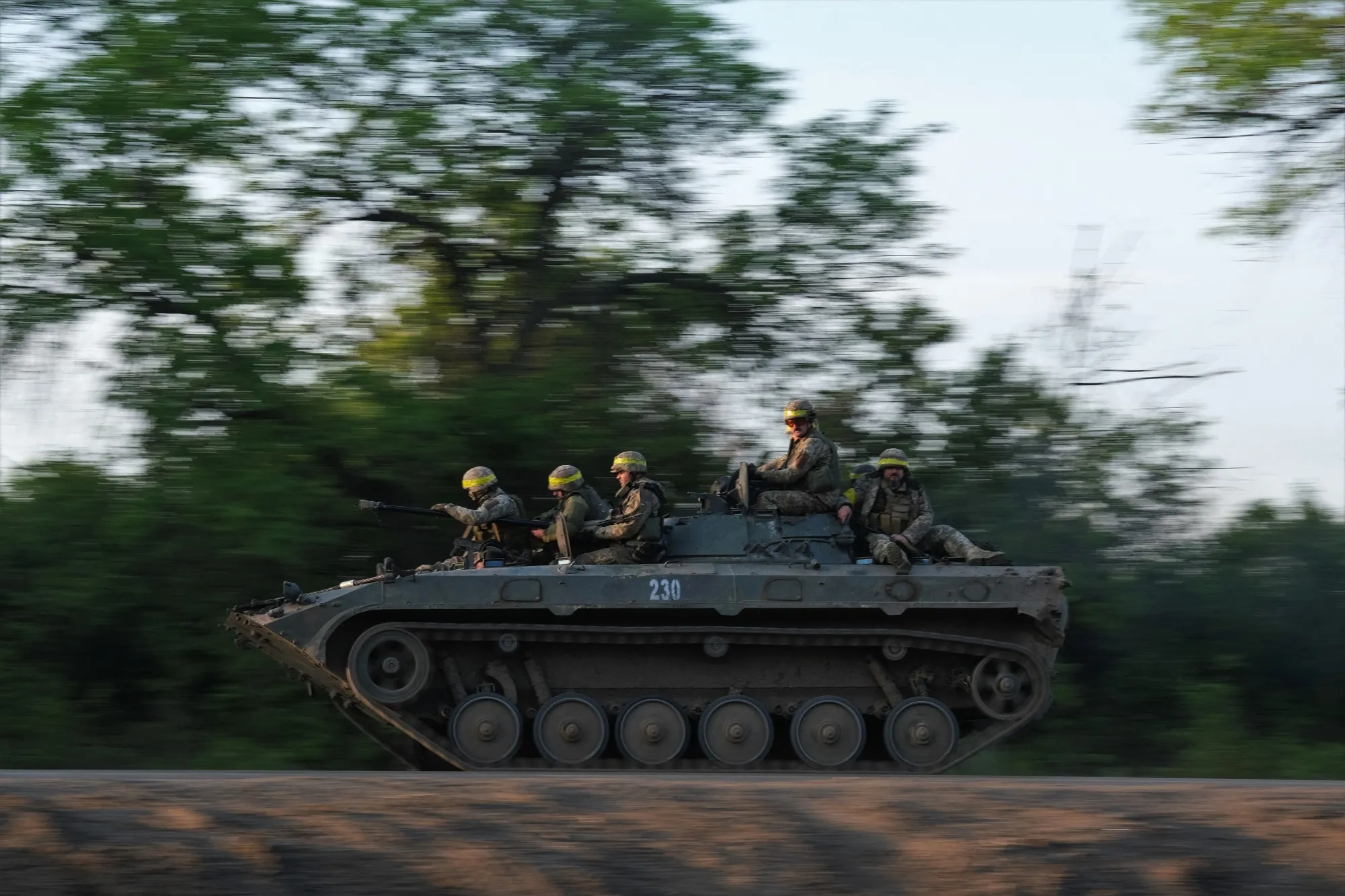 Soldiers ride on an infantry fighting vehicle toward Bakhmut&nbsp;on May 20.