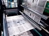Pages for the Dallas Morning News are fed through a printing press in Plano, Texas, U.S., on Thursday, Dec., 17, 2009. U.S. newspaper publishers' revenue dropped 8.3 percent to $43.9 billion last year as advertising sales plunged, the U.S. Census Bureau said yesterday.