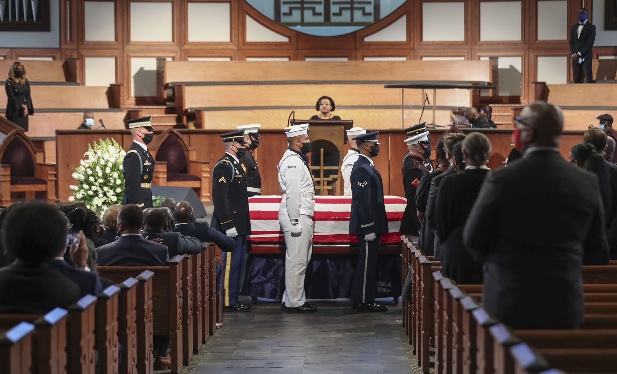 The Honor Guard carries the body of John Lewis after the service in Atlanta on July 30.