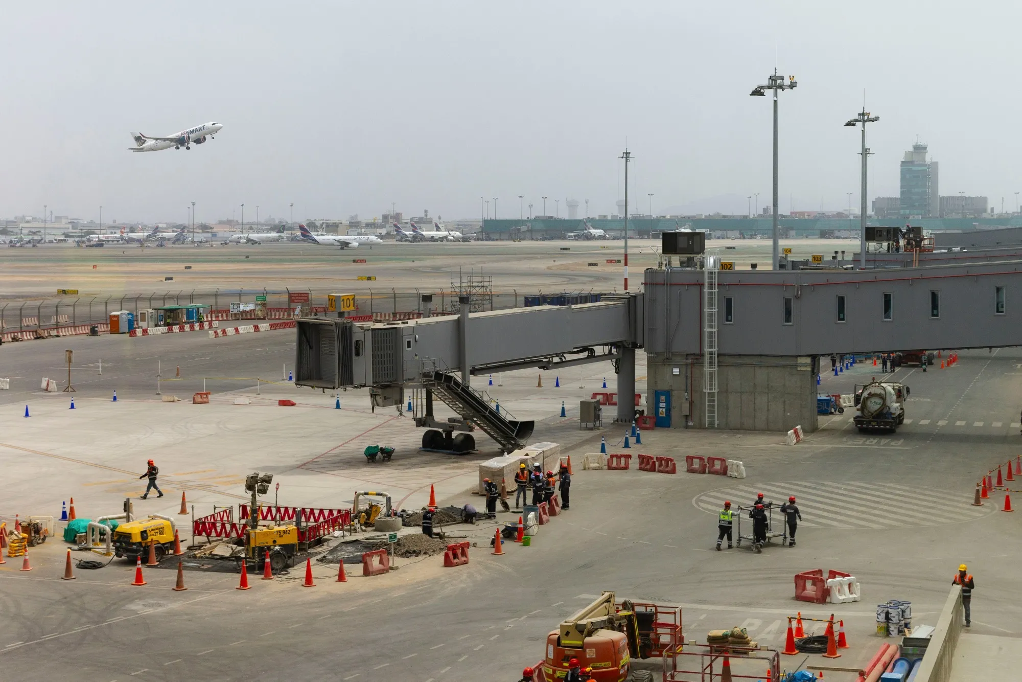 Workers on the apron in the departures terminal of the new Jorge Chavez Airport (LIM) in Lima, Peru, on Thursday, Dec. 5, 2024.