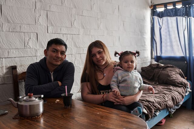 Oriana Gago, a 22-year-old mother , and her partner Samir Santa Cruz and their daughter Chiara in the living room of their apartment in Lugano neighborhood of Buenos Aires.
