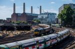 Passenger trains pass Grosvenor Road Depot in London, UK.