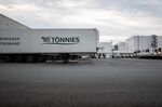 Trucks stand at the Toennies GmbH meat plant near Guetersloh, Germany, on June 17.