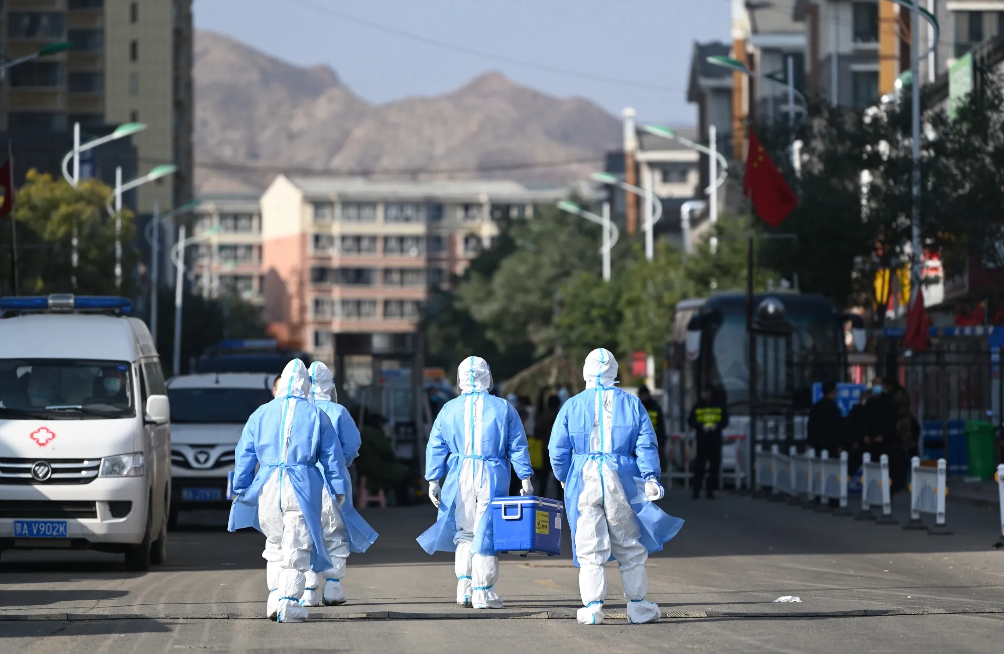 Medical workers at a residential community where residents are under lockdown in Hohhot, Inner Mongolia on Oct. 23.