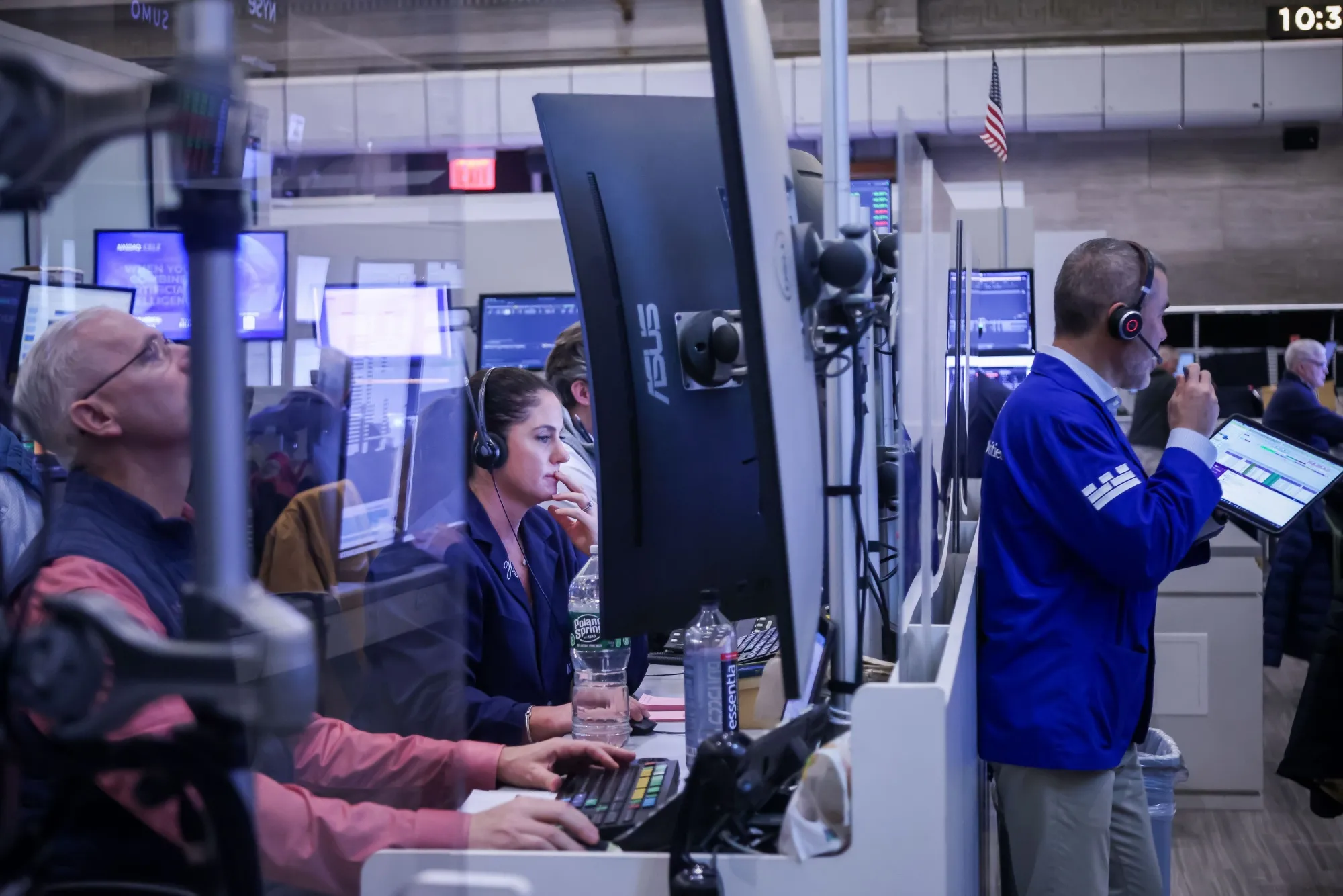 Traders work on the floor of the American Stock Exchange (AMEX) at the New York Stock Exchange (NYSE) in New York.