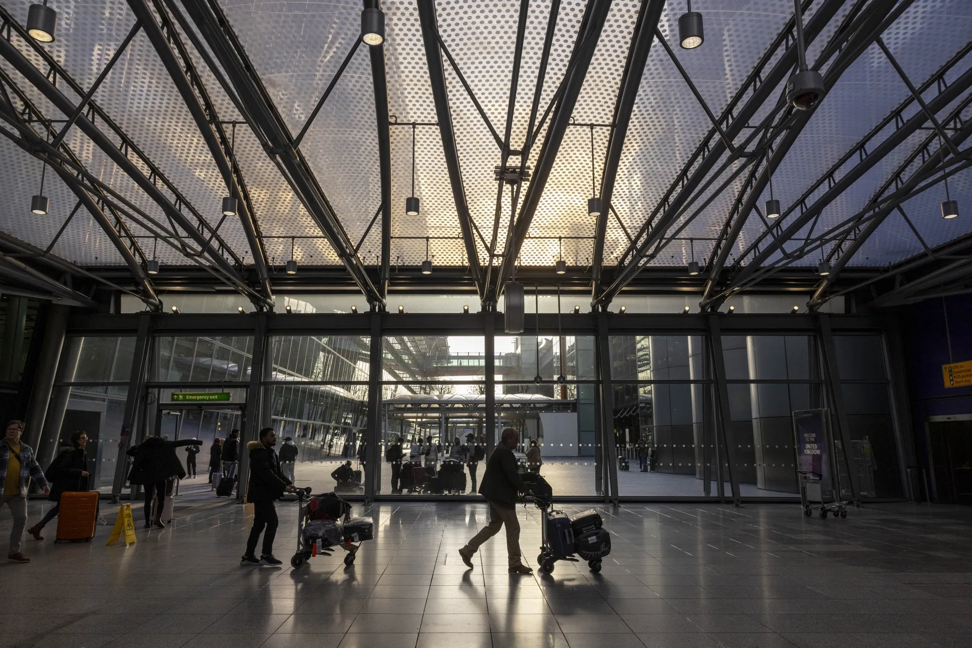Passengers in the departures hall at Heathrow Airport in London.