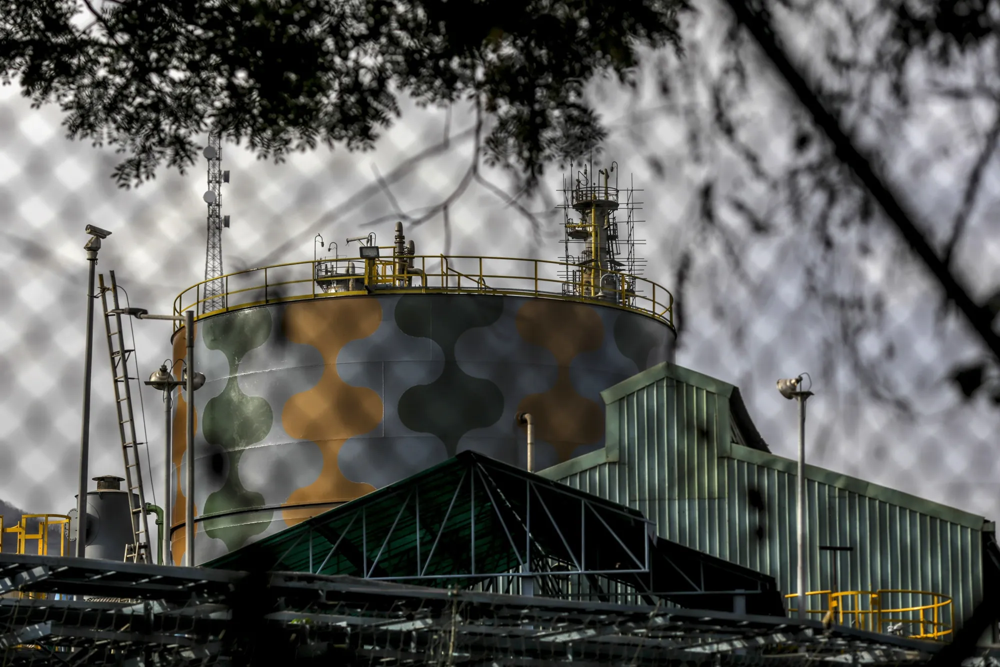 A storage tank stands at an Oil and Natural Gas Corp plant in Uran, Maharashtra, India.