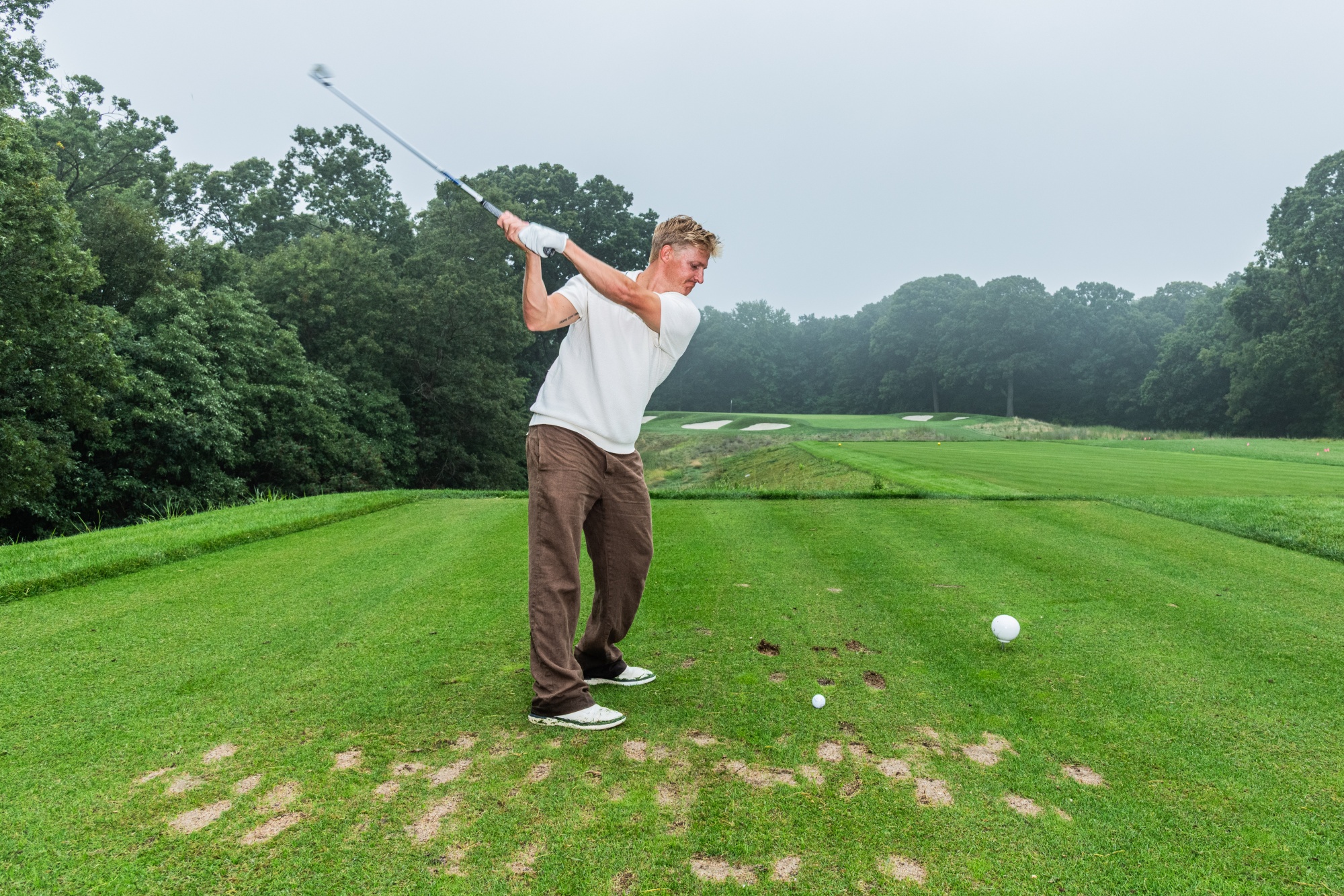 Daniel Belk tees off at Bethpage Black.
