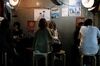Customers sit at a restaurant at night in the Shinjuku district of Tokyo, Japan, on Thursday, Nov. 19, 2020. Tokyo raised its Covid-19 alert to the highest of four levels, as daily infections in the Japanese capital increased by more than 500 for the first time amid a resurgence of the pathogen across the country.