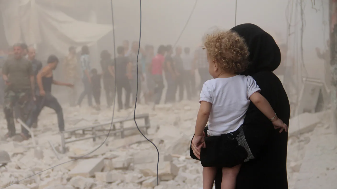 Syrian people carry wounded ones to hospital after Assad Regime Forces stage an airstrike to opposition controlled Seyh Mahsud district of Aleppo, Syria.
