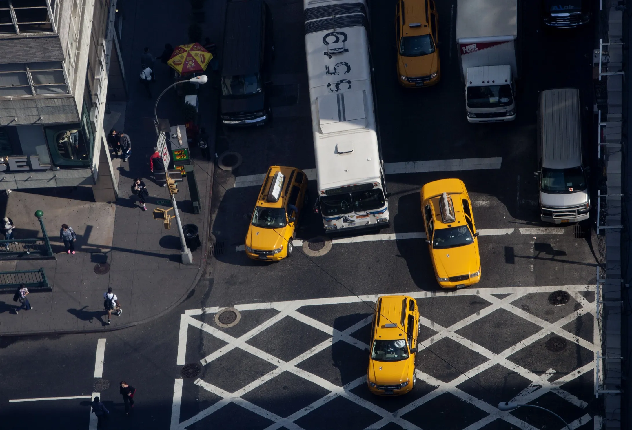 Buses and taxis drive down Lexington Avenue in New York.