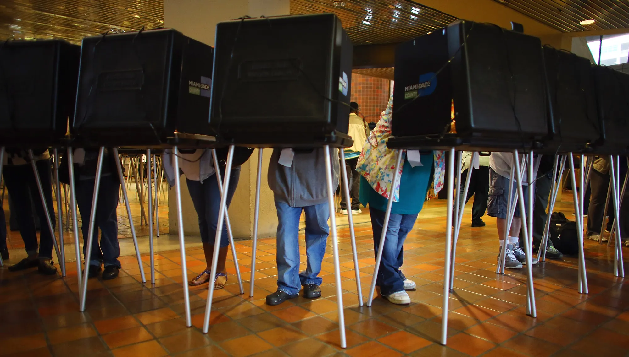 Voters fill out their ballots in Miami.