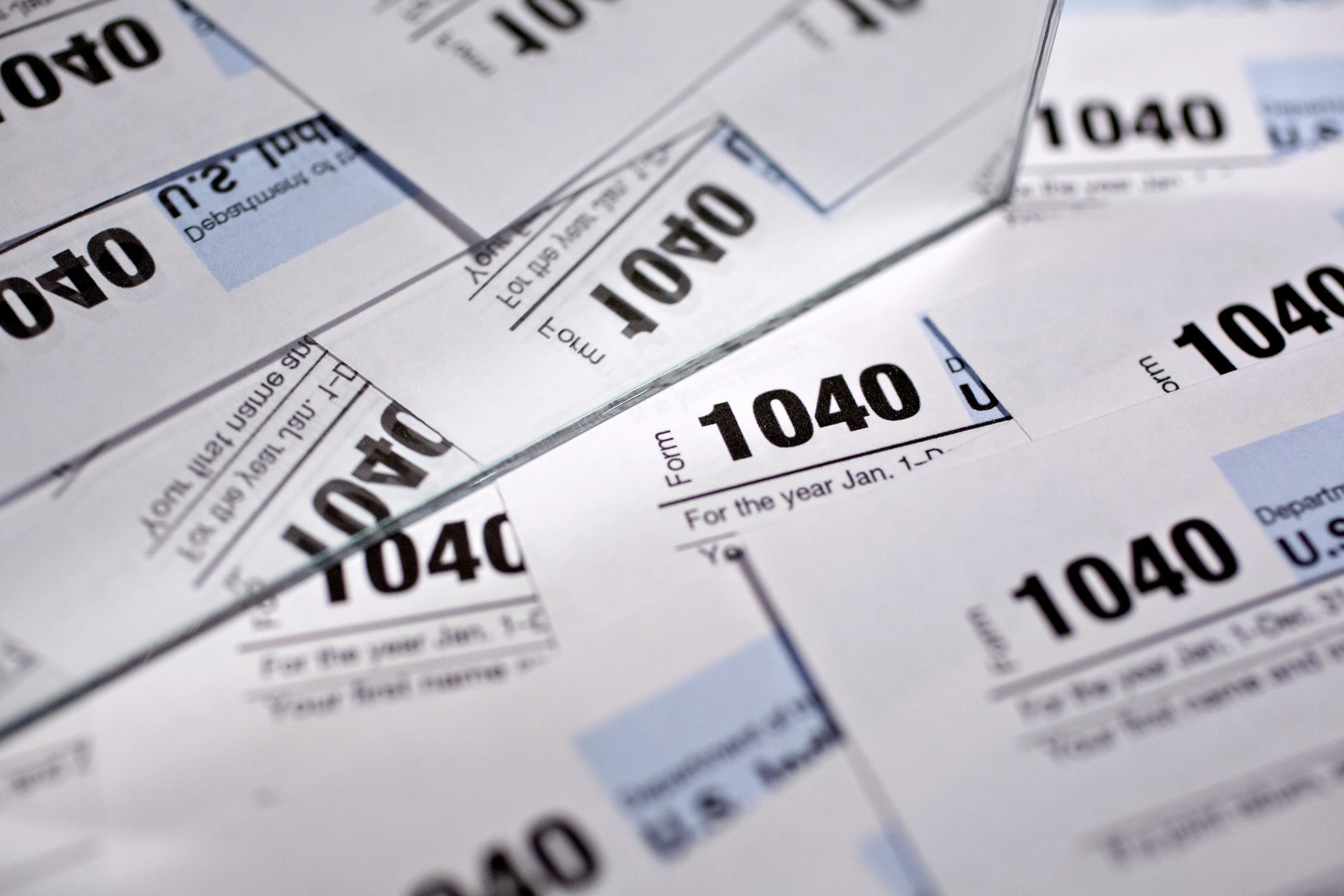 U.S. Department of the Treasury Internal Revenue Service (IRS) 1040 Individual Income Tax forms for the 2016 tax year are arranged for a photograph in Tiskilwa, Illinois, U.S., on Monday, Dec. 18, 2017. This week marks the last leg of Republicans' push to revamp the U.S. tax code, with both the House and Senate planning to vote by Wednesday on final legislation before sending it to President Donald Trump.