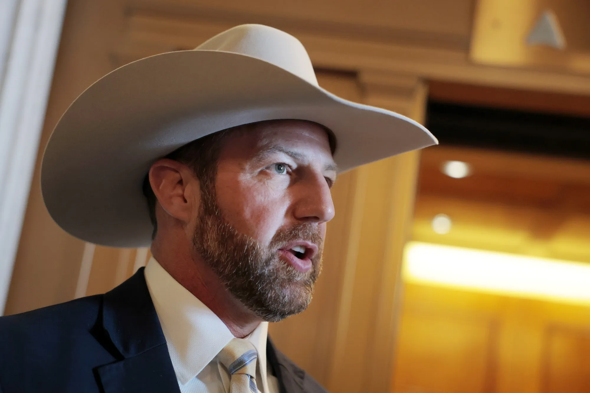 New boss, same hat.