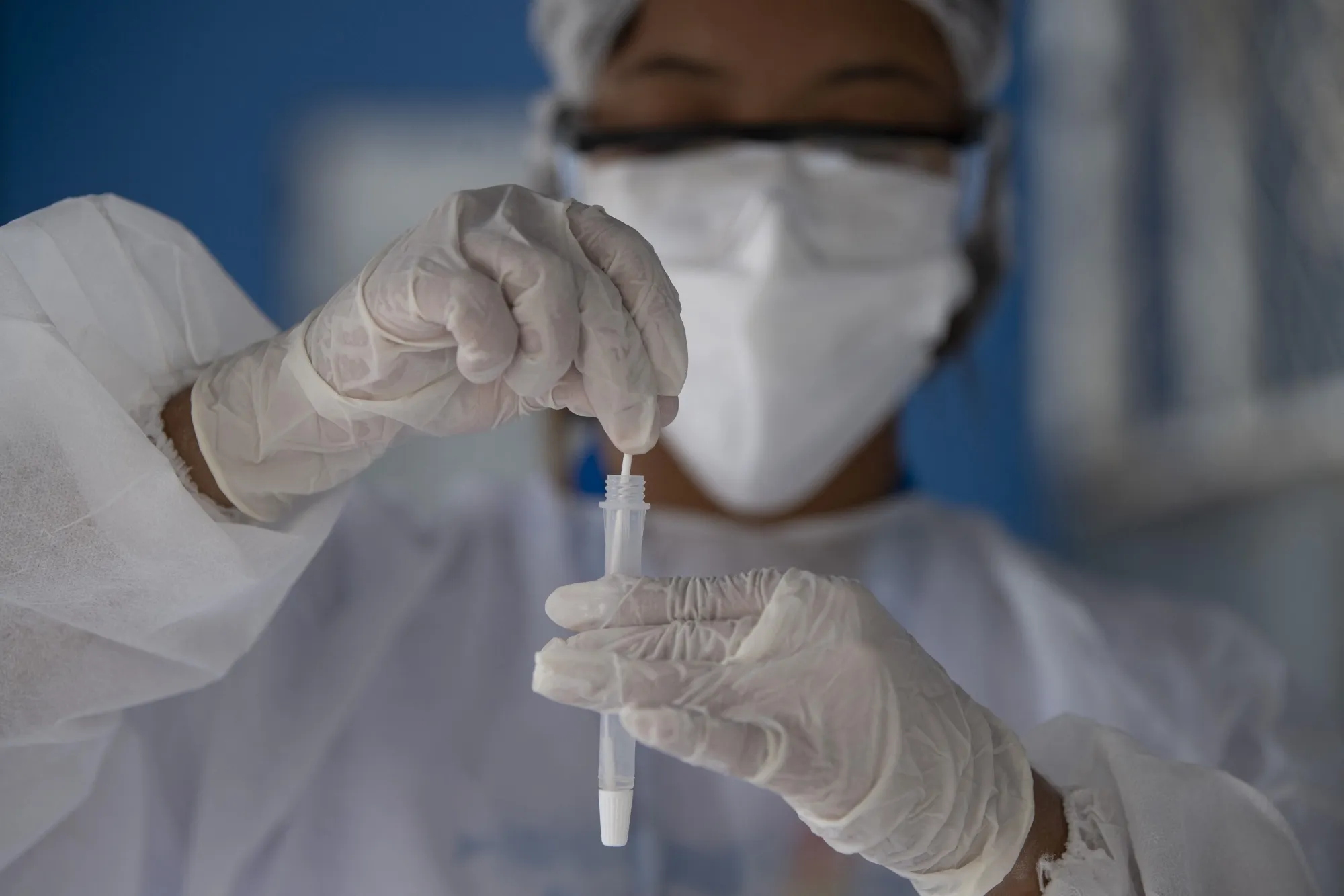 A health worker collects a Covid-19 swab test from a patient&nbsp;in Rio de Janeiro,&nbsp;in Dec. 2021.&nbsp;