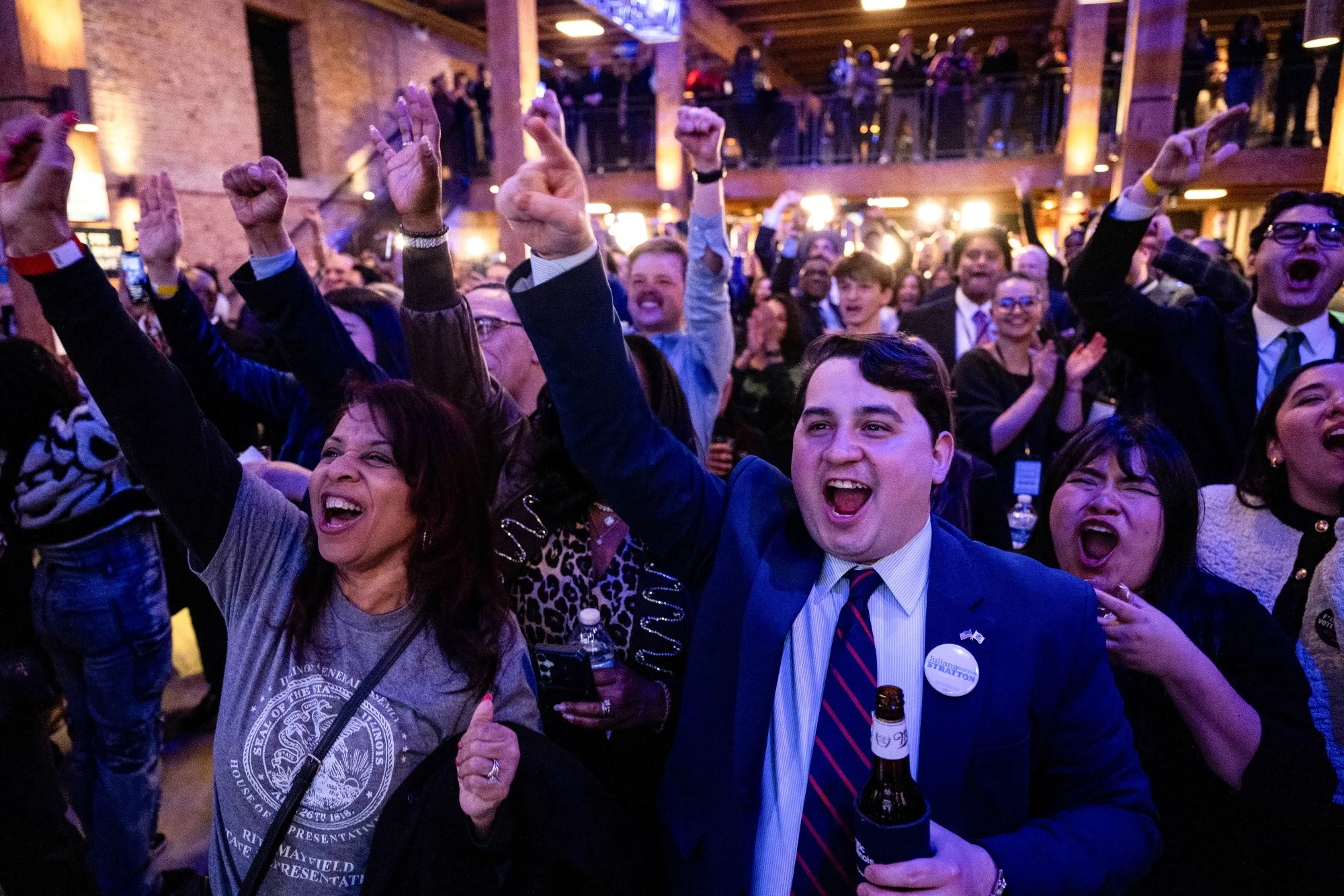 Supporters of Democratic Senate candidate Juliana Stratton react as vote totals come in.