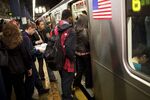 Morning commuters crowding into a New York subway car